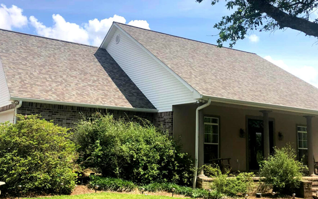 Newly completed house with clean cut looking shingles.
